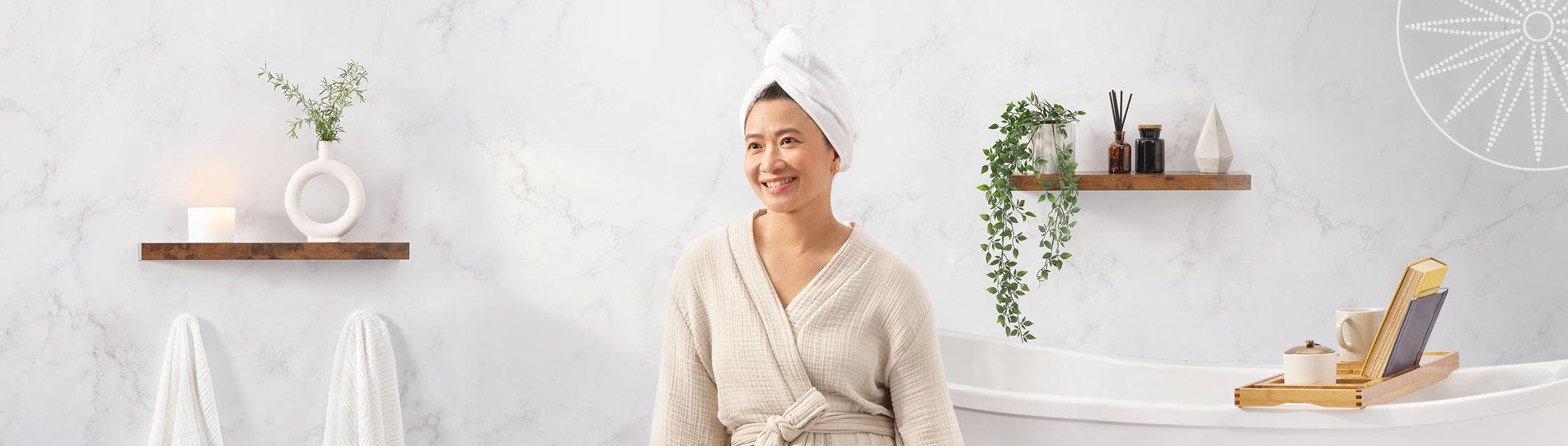 middle-aged Asian woman smiling leaning on her bathtub in her nice new bathroom